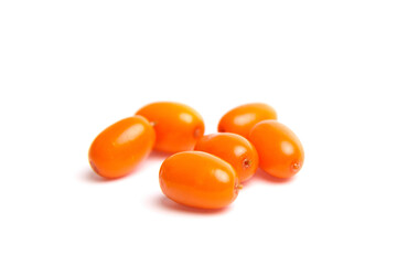 A close-up of six bright orange sea buckthorn berries with a smooth, glossy surface, scattered on a white background. Rich in antioxidants and commonly used in health foods