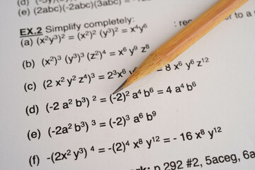 Pencil on mathematic formula exercise test paper in education school.