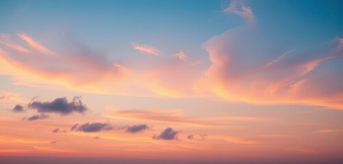 Obraz premium Soft pastel hues paint the twilight sky; wispy clouds catch the fading sunlight, beautiful, orange