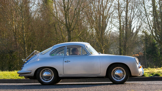 Stony Stratford,UK - Mar. 2nd 2025:   1961 Porsche 356 classic cardriving on a British road.