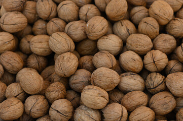 Gathering fresh walnuts in a rustic market during autumn harvest season