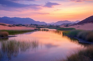 Fototapeta premium Magical desert oasis at twilight, water shining with sunset