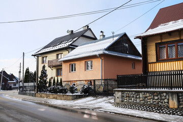 DURSZTYN, POLAND - MARCH 17, 2025: Old-style multi-family houses in a mountain town.