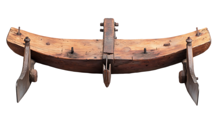 Antique wooden neck yoke with metal supports is displayed