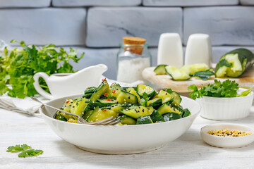 Japanese smashed cucumber salad in a white bowl