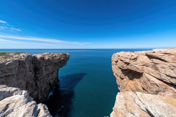 A stunning view from a rocky cliffside extending over the expansive ocean, showcasing a breathtaking landscape and the beauty of nature in perfect balance.