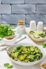 Japanese smashed cucumber salad in a white bowl