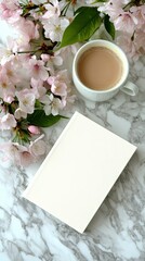 Morning relaxation with a cup of tea near blooming cherry blossoms on marble table during springtime