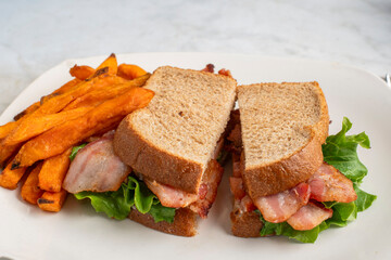 blt sandwich  served with sweet potato fries