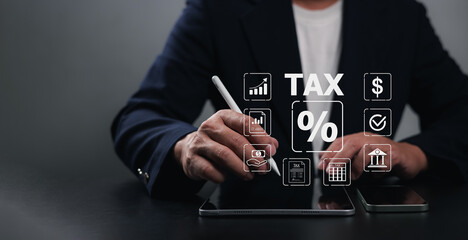 Tax documents and savings, Income tax, Represent the concept of tax return preparation and financial management, Businessman calculates taxes using calculator and tablet, Submit request refund tax.