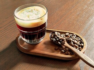 Hot coffee on a wooden table