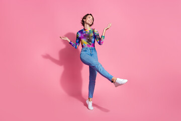 Full length portrait of pretty young girl dancing partying wear pullover isolated on pink color background