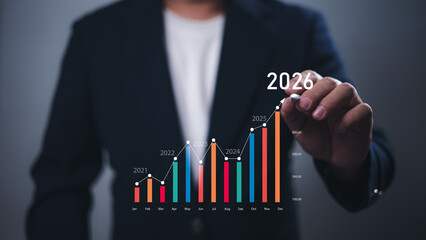 Growth 2026 goal and development chart of company to success future, Businessman hand and Economic...