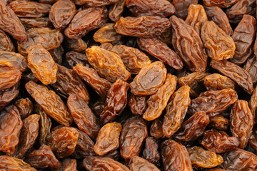 Raisins on a white background. Dried grapes.