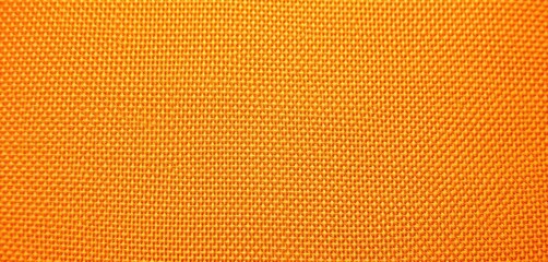Close-up textured orange stockinet fabric background, stockinet, orange background