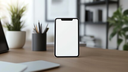 Mobile phone blank white screen mockup with digital drawing tablet in creative workspace.