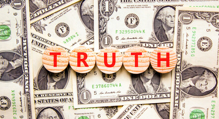 Truth symbol. Concept word Truth on beautiful wooden circles. Beautiful dollar bills. Beautiful...