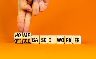 Home or office based worker symbol. Concept words Office based worker Home based worker on wooden cubes. Beautiful orange background. Business, home or office based worker concept. Copy space.