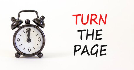 Turn the page symbol. Concept words Turn the page on beautiful white paper. Alarm clock. Beautiful white paper background. Business motivational lifestyle turn the page concept. Copy space.