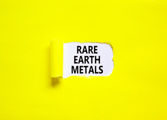 Rare earth metals symbol. Concept words Rare earth metals on beautiful white paper. Beautiful yellow paper background. Business and rare earth metals concept. Copy space.