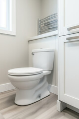 A modern bathroom corner with a white ceramic toilet