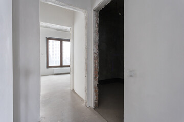 interior of the apartment without decoration in gray colors. rough finish