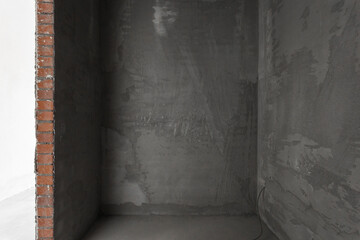 interior of the apartment without decoration in gray colors. rough finish
