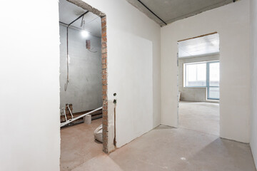 interior of the apartment without decoration in gray colors. rough finish