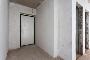 interior of the apartment without decoration in gray colors. rough finish
