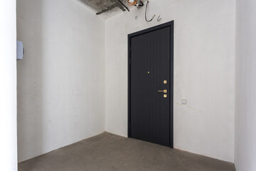 interior of the apartment without decoration in gray colors. rough finish