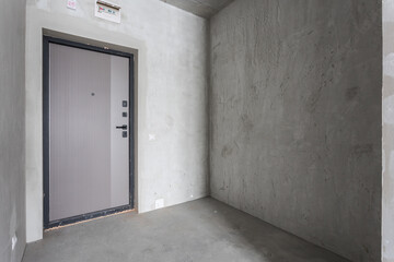 interior of the apartment without decoration in gray colors. rough finish