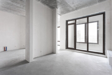 interior of the apartment without decoration in gray colors. rough finish