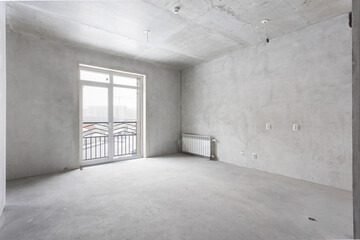 interior of the apartment without decoration in gray colors. rough finish