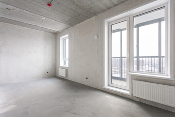 interior of the apartment without decoration in gray colors. rough finish