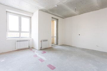 interior of the apartment without decoration in gray colors. rough finish