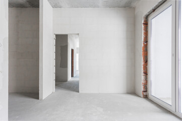 interior of the apartment without decoration in gray colors. rough finish