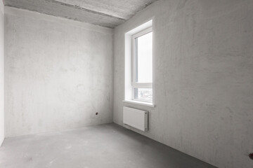 interior of the apartment without decoration in gray colors. rough finish
