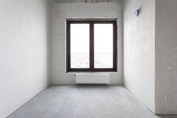 interior of the apartment without decoration in gray colors. rough finish
