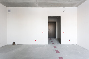 interior of the apartment without decoration in gray colors. rough finish