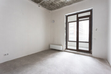 interior of the apartment without decoration in gray colors. rough finish
