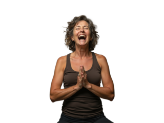 Joyful woman practicing yoga in relaxed indoor setting, wearing comfortable attire