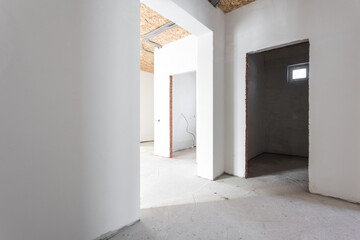 interior of the apartment without decoration in gray colors. rough finish