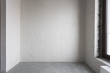 interior of the apartment without decoration in gray colors. rough finish