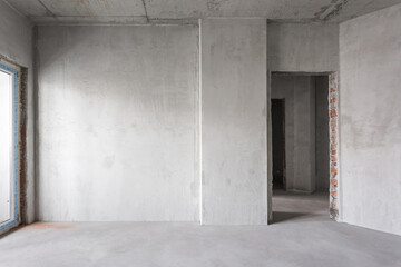 interior of the apartment without decoration in gray colors. rough finish