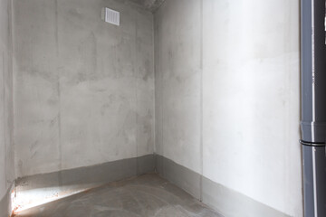 interior of the apartment without decoration in gray colors. rough finish