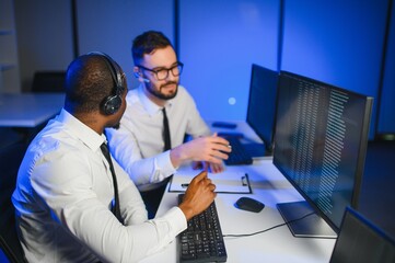 Happy Confident Technical Customer Support Specialist Having a Headset Call in a Monitoring and...
