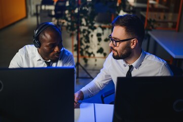 Happy Confident Technical Customer Support Specialist Having a Headset Call in a Monitoring and...