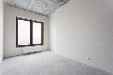 interior of the apartment without decoration in gray colors. rough finish