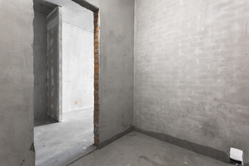 interior of the apartment without decoration in gray colors. rough finish