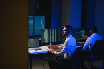 Happy Confident Technical Customer Support Specialist Having a Headset Call in a Monitoring and...
